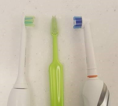 Sonicare and Oral B electric toothbrush verses manual toothbrush